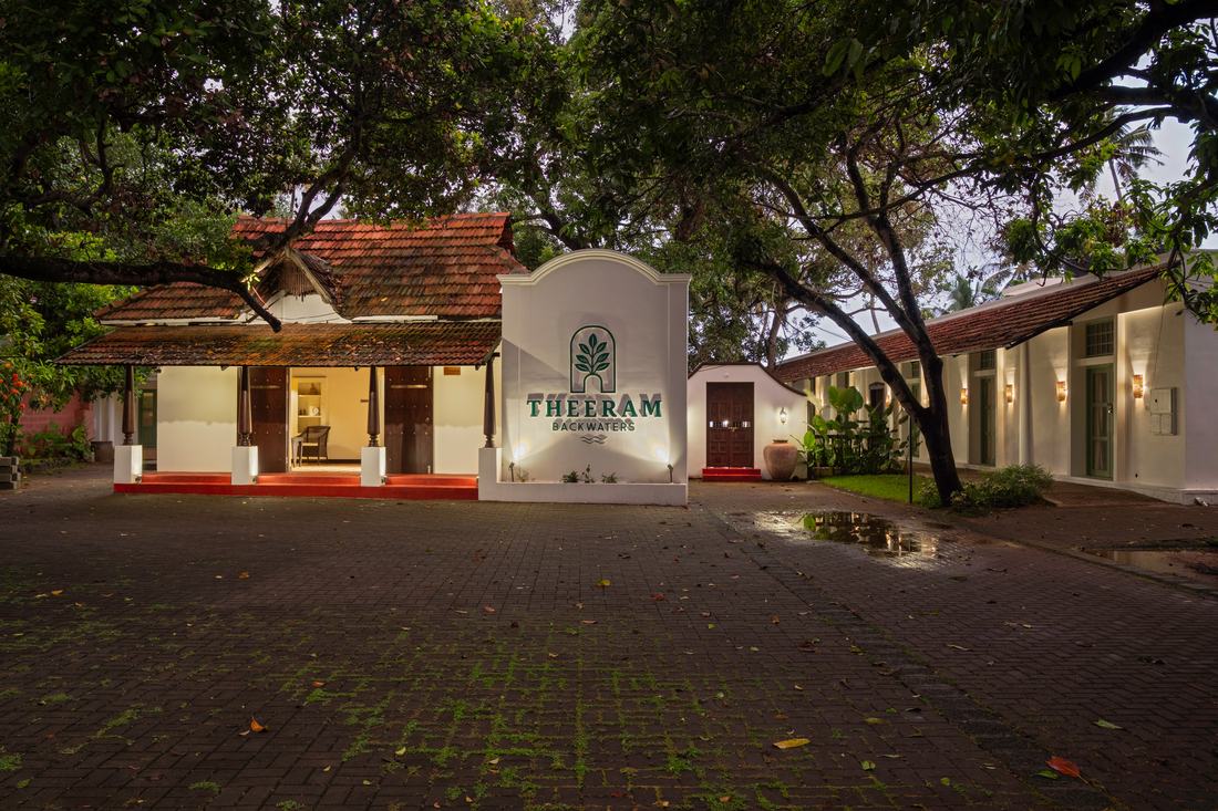 The cottages and lawn walkway at Theeram by day