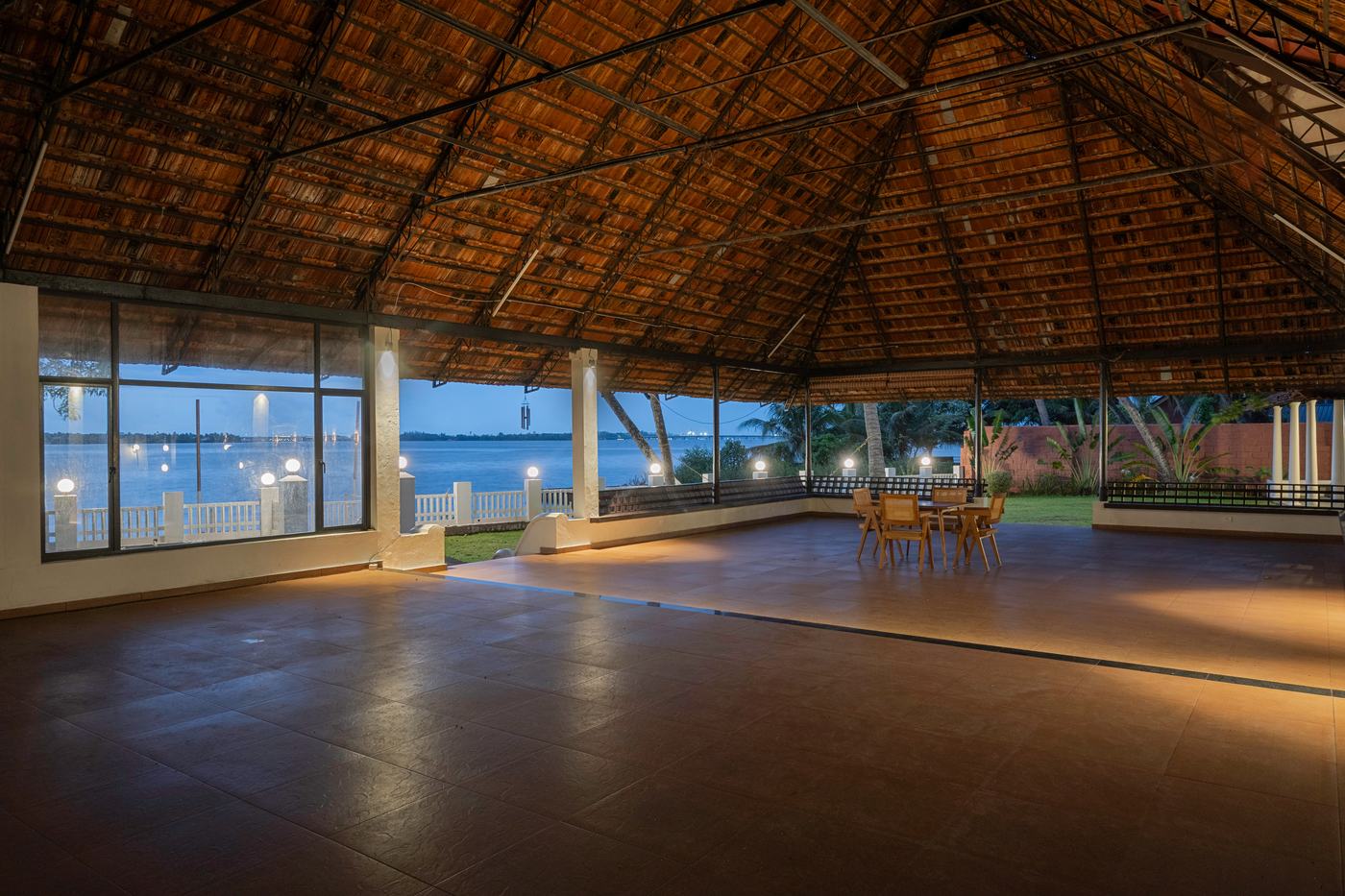 Dinner table set within the pandal at blue hour