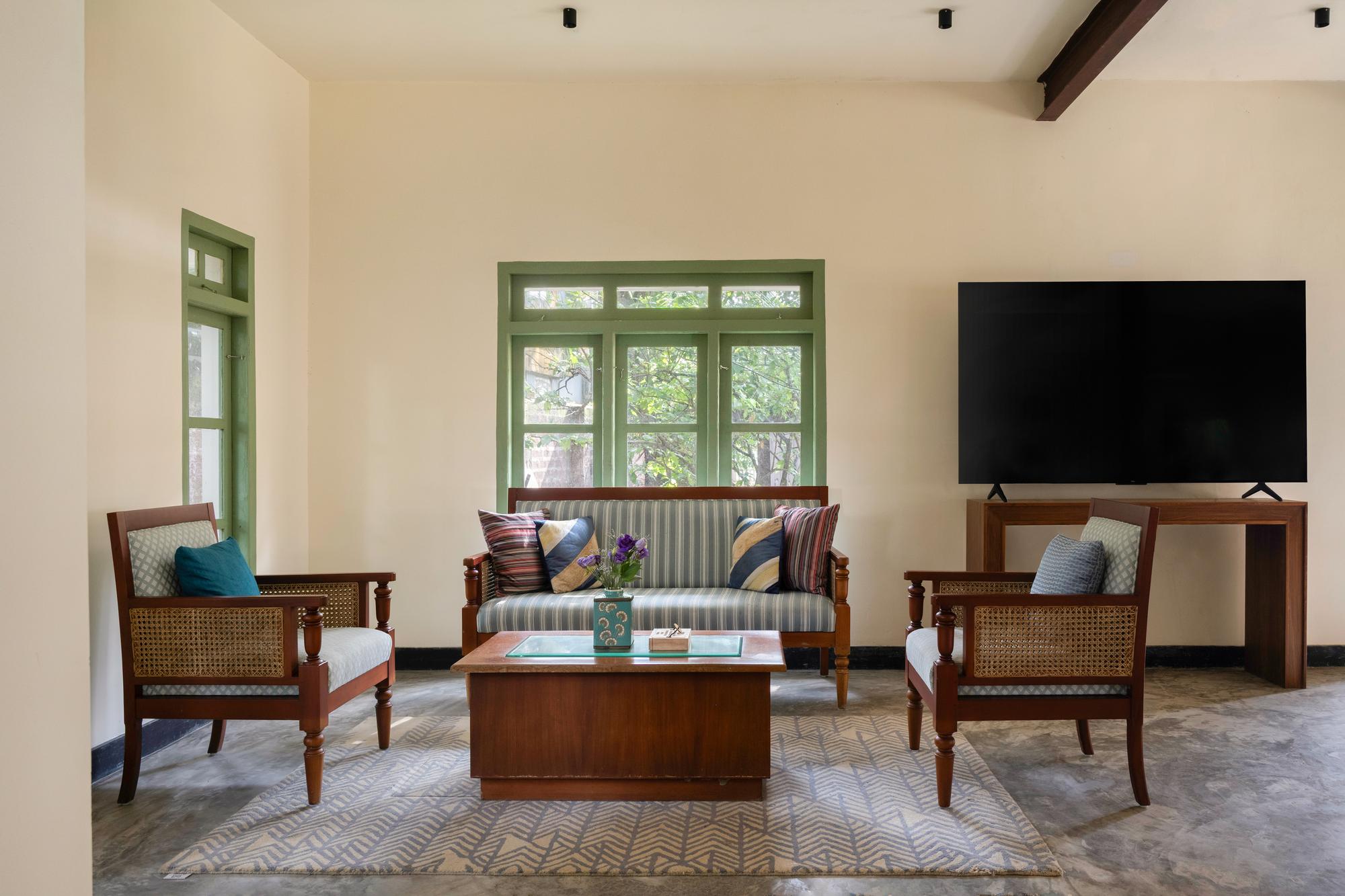 The living room inside Anchor Villa, dressed in cane and teak